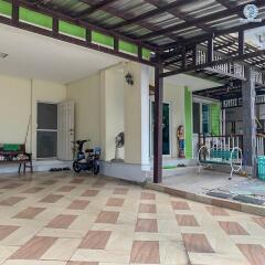 Spacious patio area with tiled flooring and exercise equipment