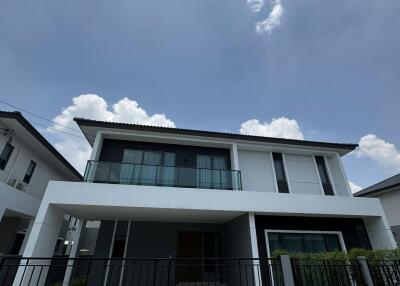 Modern two-story house with a clear blue sky