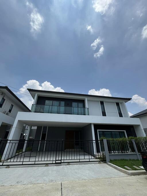 Modern two-story house with a clear blue sky