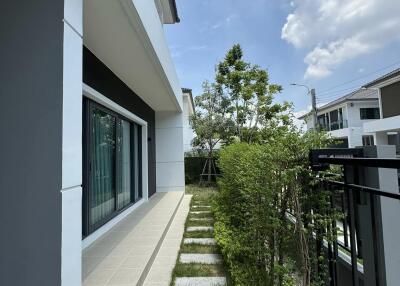 Modern home exterior with landscaped pathway