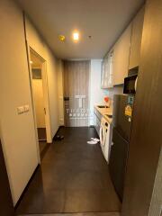 Compact modern kitchen with fully fitted appliances.