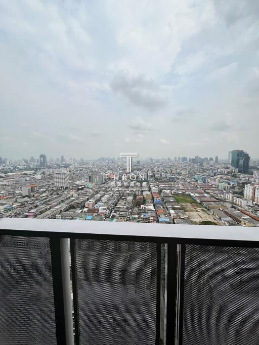 Expansive cityscape view from a high-rise balcony