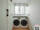 Modern laundry room with stacked washer and dryer in an apartment