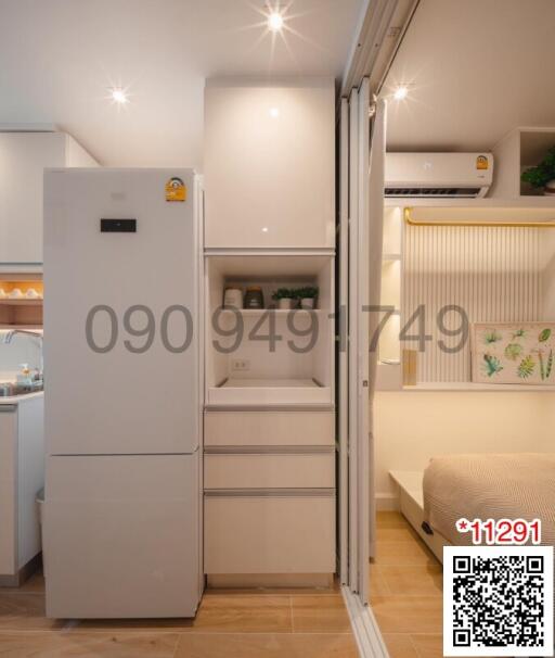 Compact bedroom with integrated appliances and modern design