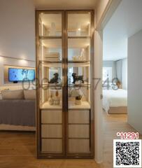 Elegant bedroom interior with a view through a glass display cabinet