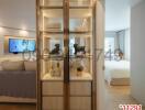 Elegant bedroom interior with a view through a glass display cabinet