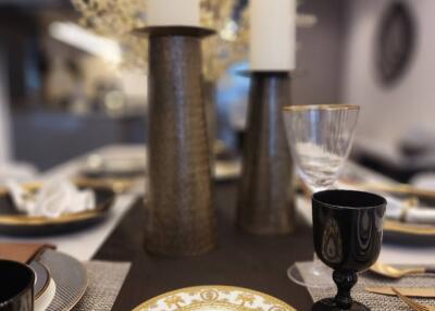 Elegantly set dining table with decorative details in a modern dining room