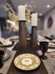 Elegantly set dining table with decorative details in a modern dining room