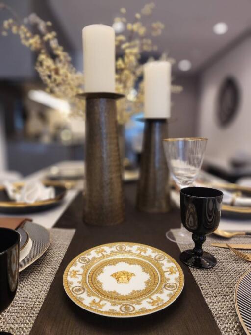 Elegantly set dining table with decorative details in a modern dining room