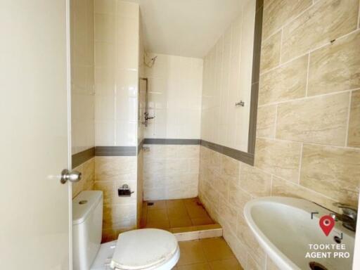 Bright clean bathroom with tiled walls and flooring
