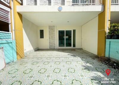 Exterior front view of a modern house with patterned tile flooring