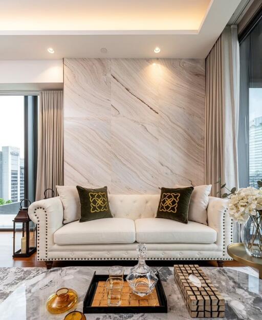 Elegant living room with marble wall and city view