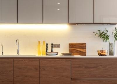 Modern kitchen with wooden cabinets and stainless steel appliances