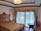 Elegant master bedroom with classic furniture and ample natural light