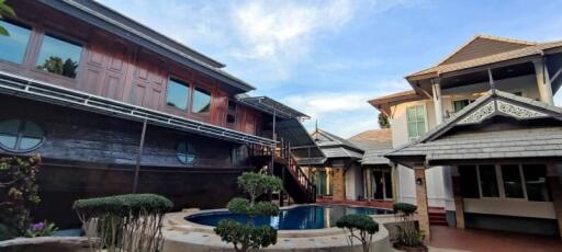 Traditional wooden houses with a swimming pool in the courtyard