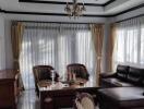 Elegant living room with natural light and classic furnishings