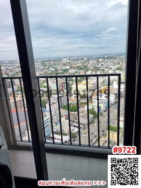 High-rise building view from a large window with cityscape