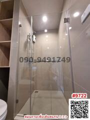 Modern bathroom interior with glass shower enclosure