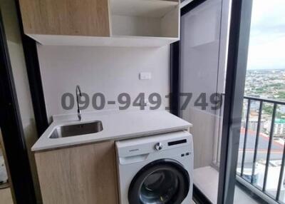 Compact utility area with washing machine and built-in storage