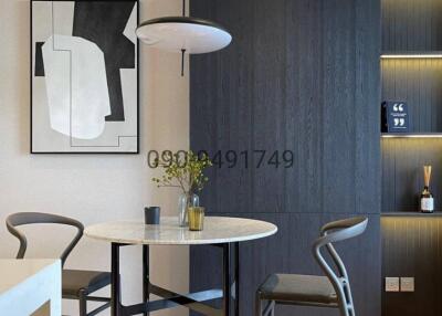 Modern dining area with stylish furniture and art
