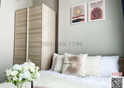 Modern bedroom with stylish decor and ample natural light