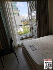 Modern bedroom with city view and natural lighting