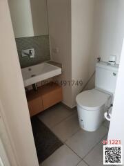 Modern bathroom with sink, faucet, and toilet