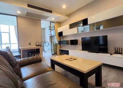 Modern living room interior with comfortable sofa and entertainment unit