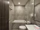 Modern bathroom with marble tiles and white fixtures