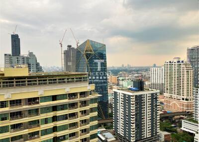 City skyline view from high-rise apartment balcony