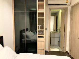 Compact bedroom with mirrored wardrobe and en-suite bathroom