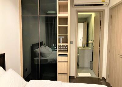 Compact bedroom with mirrored wardrobe and en-suite bathroom
