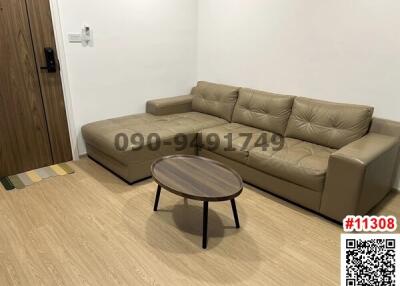 Modern living room with beige sofa and wooden coffee table