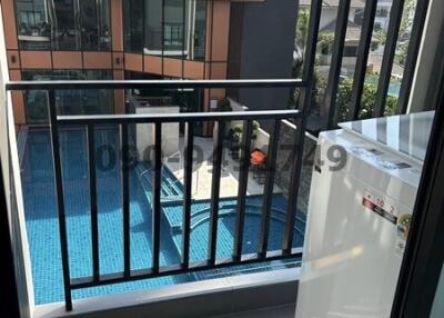 Compact balcony overlooking a pool