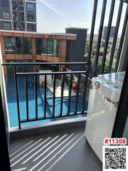 Compact balcony overlooking a pool