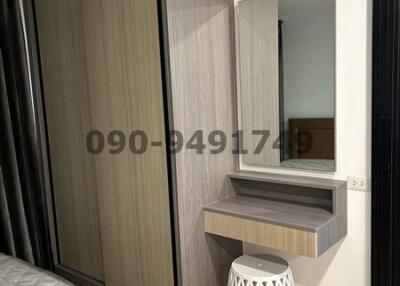 Compact modern bedroom with large wardrobe and air conditioning unit