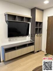 Modern living room interior with mounted television and minimalist shelving