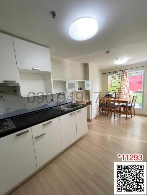 Spacious kitchen with modern appliances and dining area