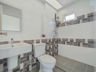 Modern bathroom with tiled walls and floor