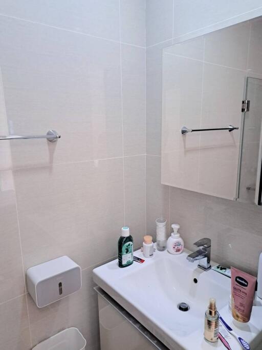 Modern bathroom with white tiles and sink