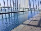 Modern rooftop swimming pool with city skyline view