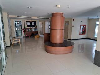 Spacious and well-lit building lobby with seating area