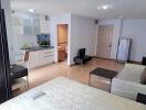 Spacious open plan living room with attached kitchen in a modern apartment