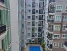 Apartment building courtyard with swimming pool