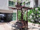 Cozy seating area with bench and pergola in the outdoor communal space of an apartment complex