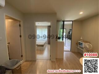 Bright living room with hardwood floors and sliding glass door leading to balcony