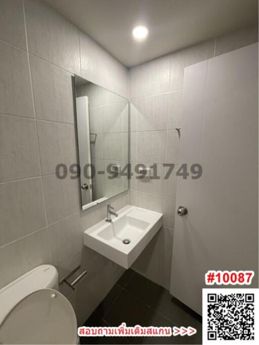 Modern bathroom interior with tiled walls