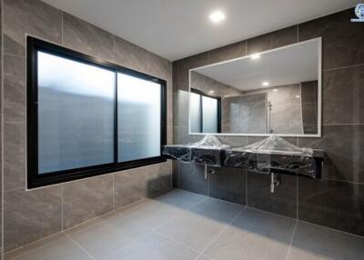 Modern bathroom with double vanity and large mirror