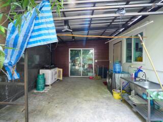 Spacious utility area with laundry and storage capabilities