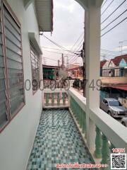 Spacious balcony with a view of the neighborhood